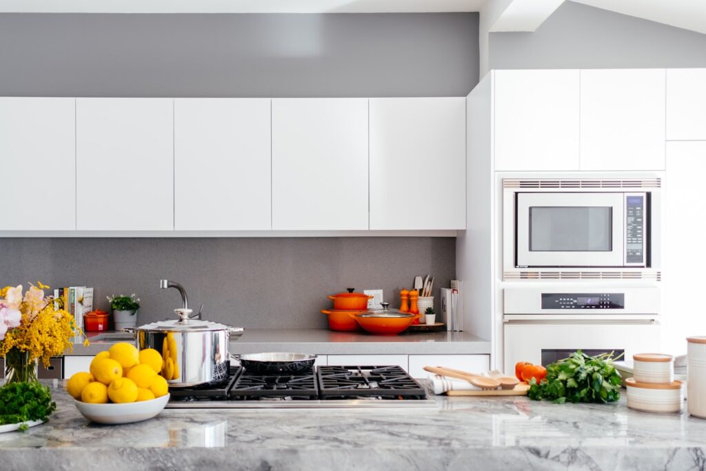 modern white kitchen with marble island